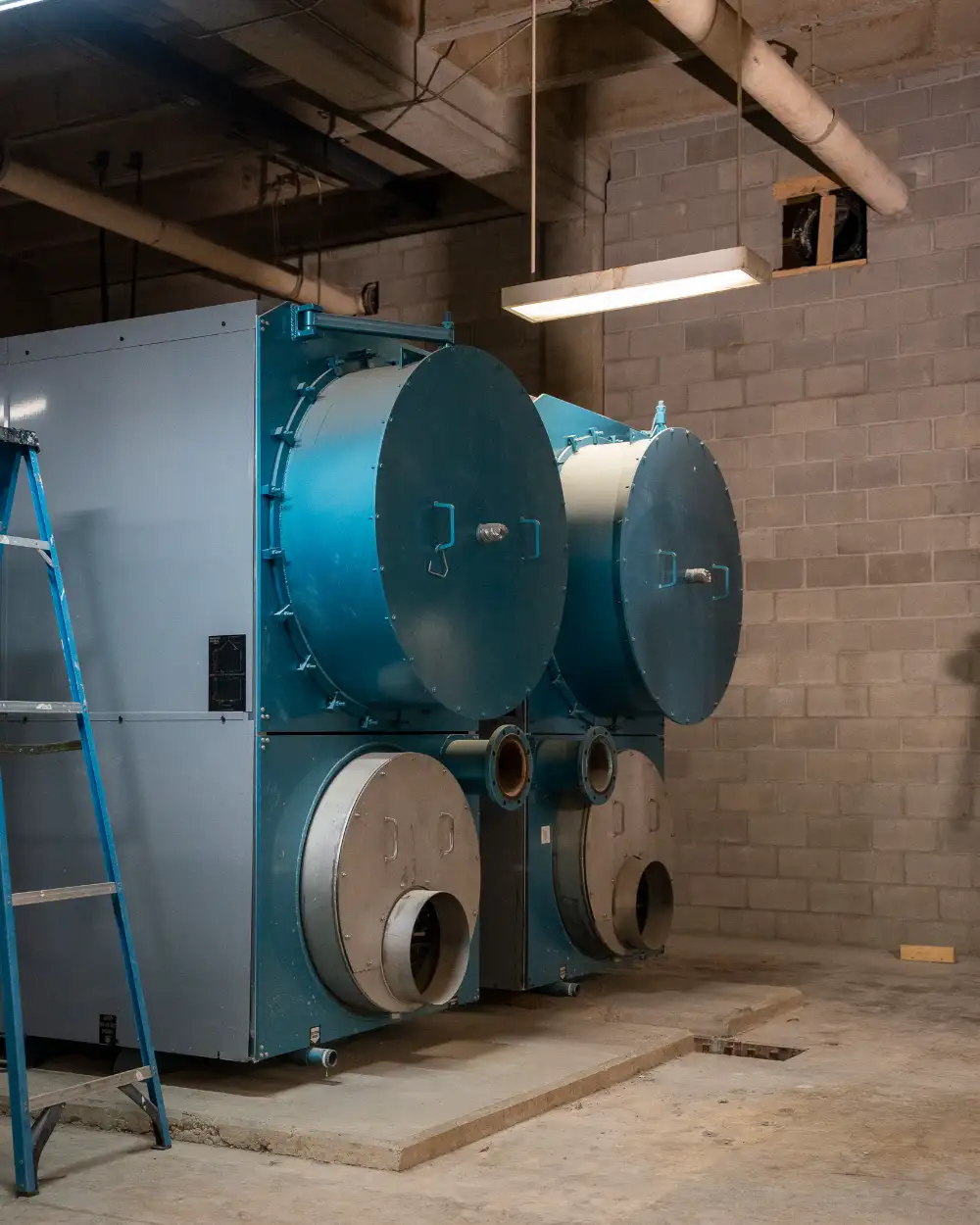 Accurate Air Solutions technician diagnosing commercial HVAC system repair in Texas